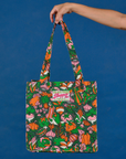 Kitchen Collection Printed Shopper Tote held up by model