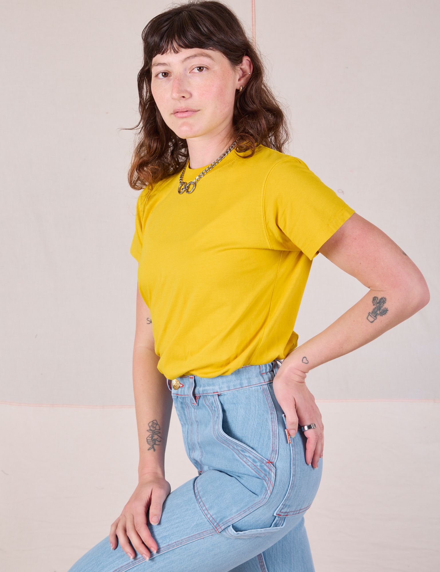 Side view of Organic Vintage Tee in Golden Yellow on Alex