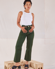 Mika is 5'1" and wearing Petite XXS Organic Work Pants in Swamp Green paired with Racerback Tank in vintage tee off-white