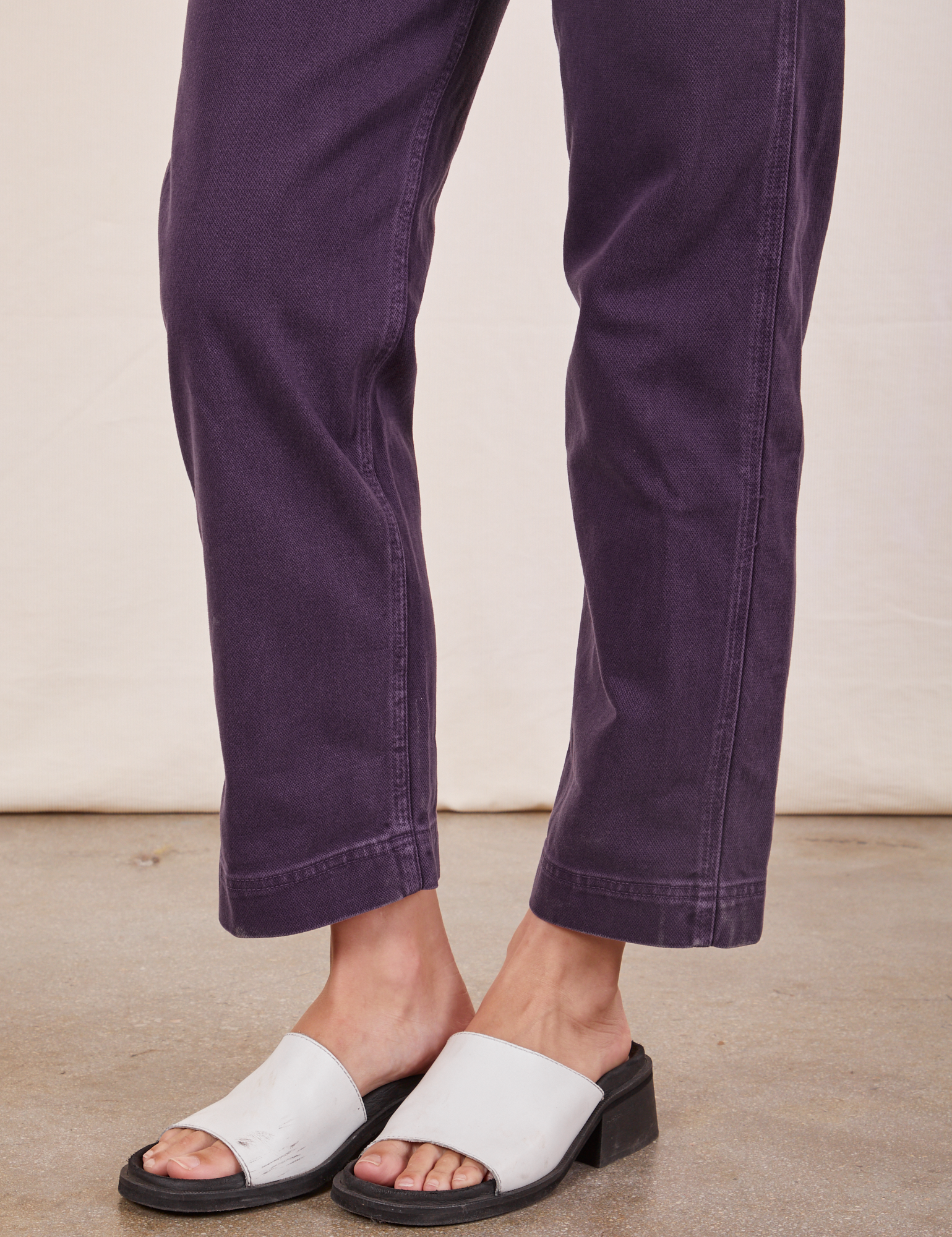 Pant leg close up of Original Overalls in Mono Nebula Purple worn by Alex