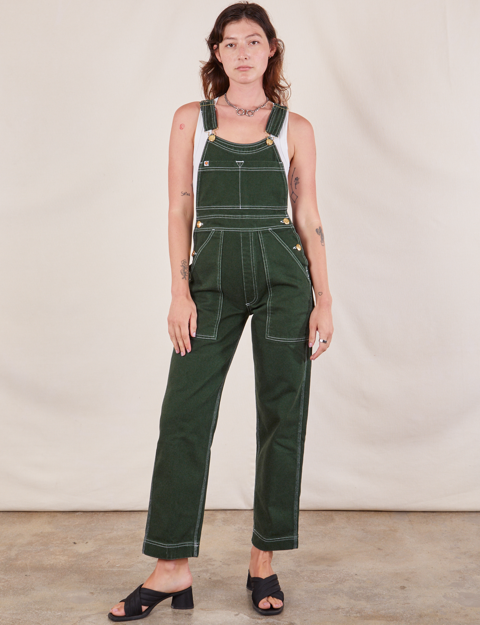 Alex is 5&#39;8&quot;and wearing P Original Overalls in Swamp Green