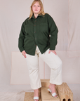 Juliet is wearing a buttoned up Twill Overshirt in Swamp Green and vintage tee off-white Western Pants