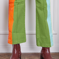Pant leg close up of Hand-Painted Stripe Western Pants in Bright Olive worn by Jesse