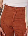 Front close up of Hand-Painted Stripe Western Pants in Burnt Terracotta worn by Gabi