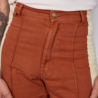 Front close up of Hand-Painted Stripe Western Pants in Burnt Terracotta worn by Gabi
