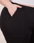 Petite Pencil Pants in Basic Black front pocket close up. Ashley has her hand in the pocket.