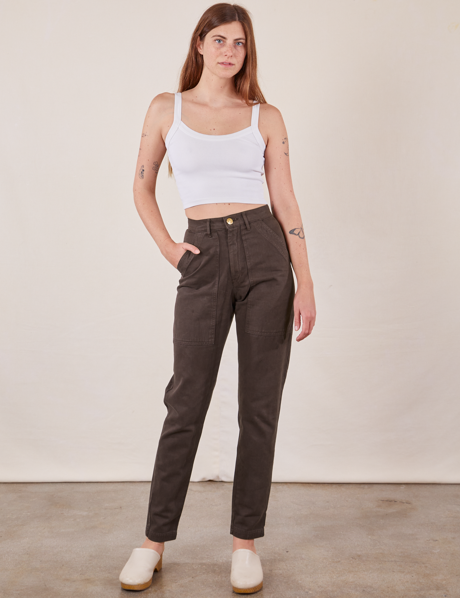 Scarlett is 5&#39;9&quot; and wearing XS Pencil Pants in Espresso Brown paired with vintage off-white Cami