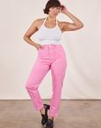 Tiara is 5'4" and wearing XS Pencil Pants in Bubblegum Pink paired with vintage off-white Halter Top
