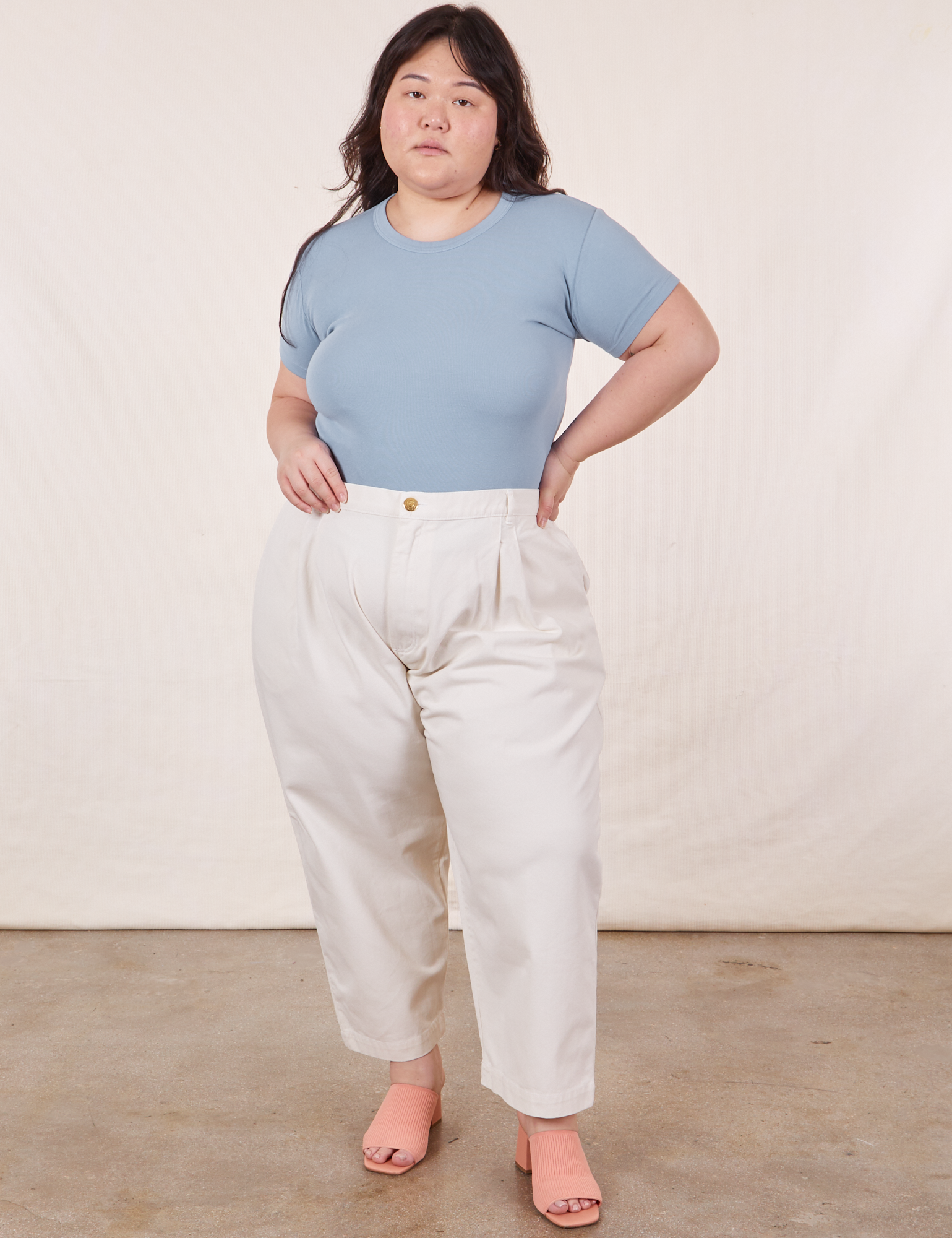 Ashley is wearing Baby Tee in Periwinkle and vintage off-white Trousers