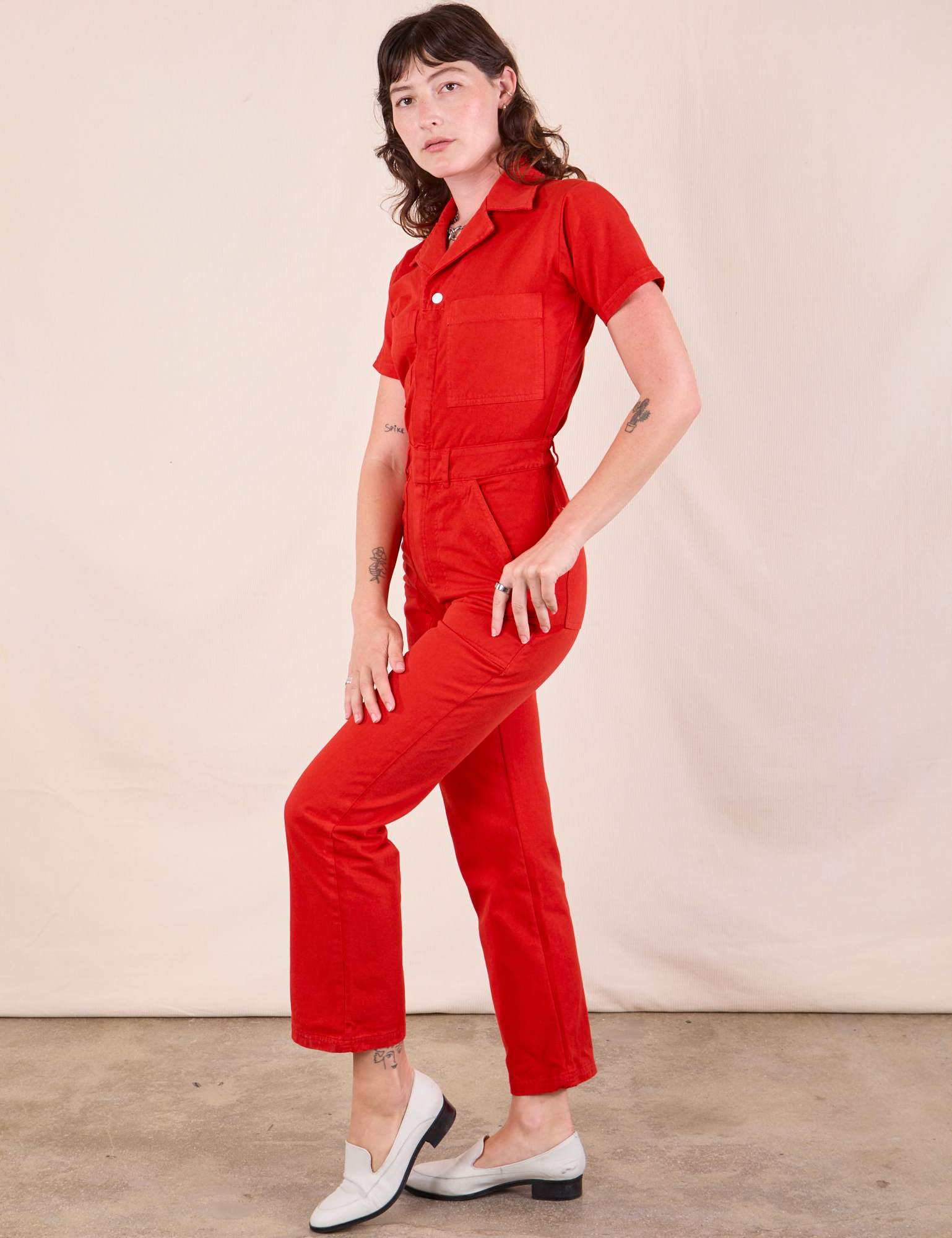 Short Sleeve Jumpsuit in Mustang Red side view on Alex