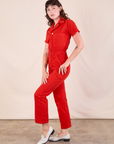 Short Sleeve Jumpsuit in Mustang Red side view on Alex