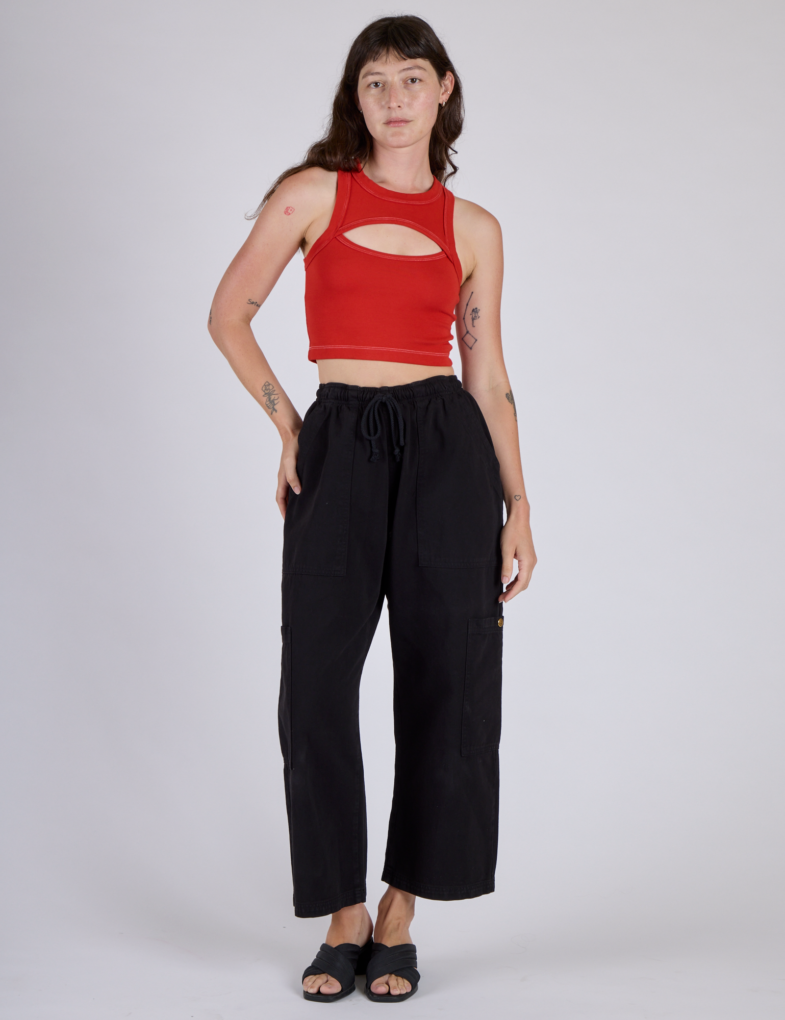 Alex in the Mustang Red Porthole Tank and Black Drop Pocket Cargo Pants