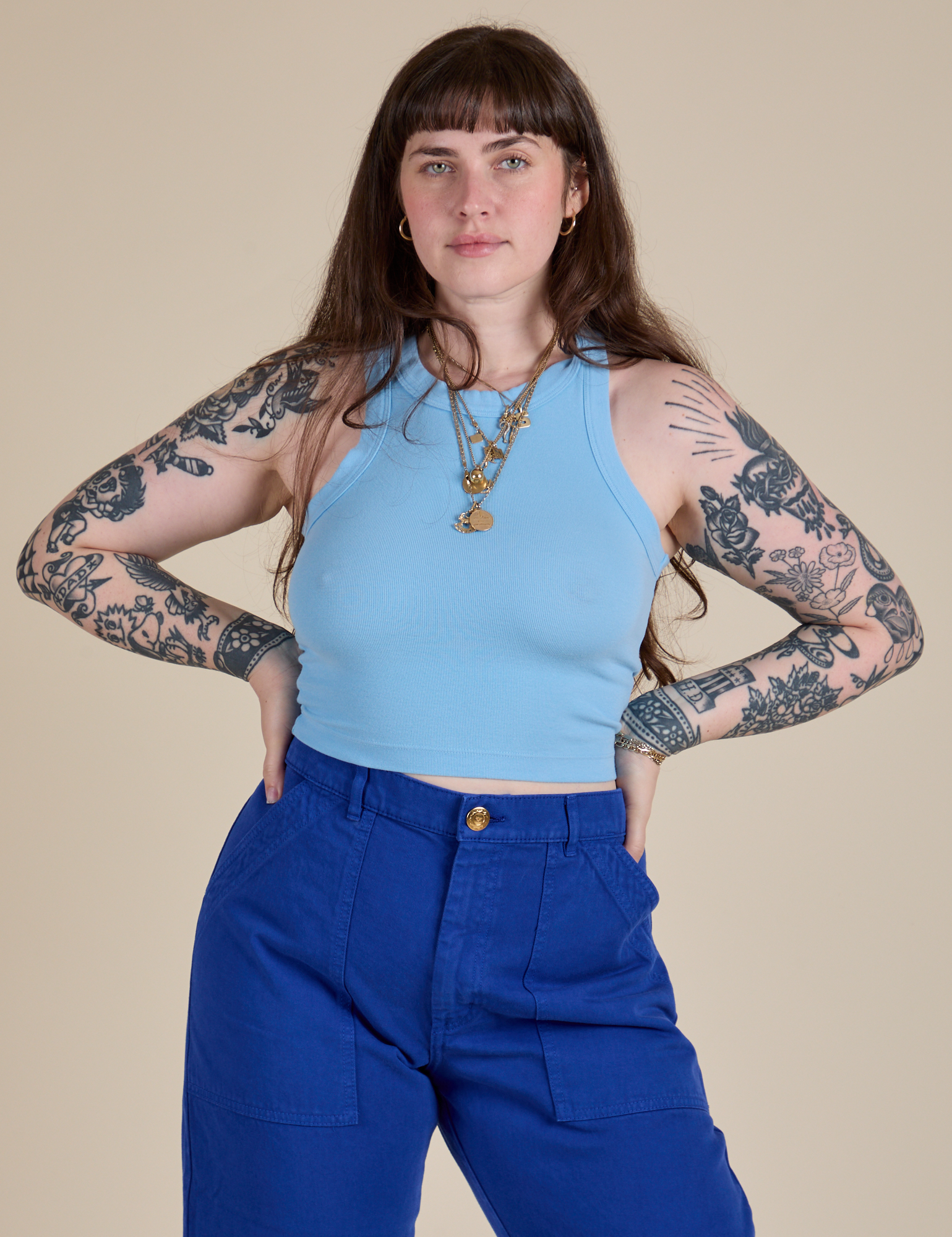 Sydney is 5’9” and wearing XXS Racerback Tank in Baby Blue