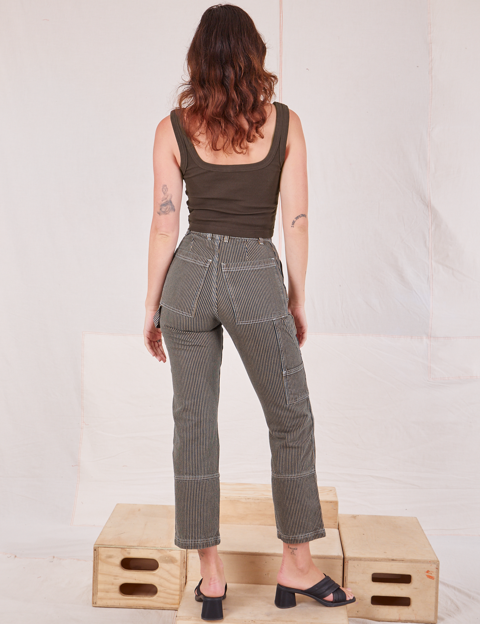 Back view of Railroad Carpenter Jeans in Vintage Tan and espresso brown Square Neck Tank on Alex