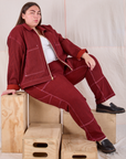 Marielena is wearing Mechanic Jacket in Mustang Red and matching Carpenter Jeans