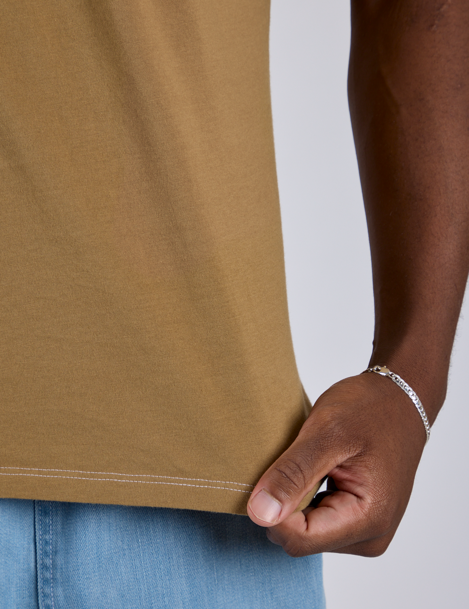 Jr. Varsity Tee in Desert Brown close up on Isaac