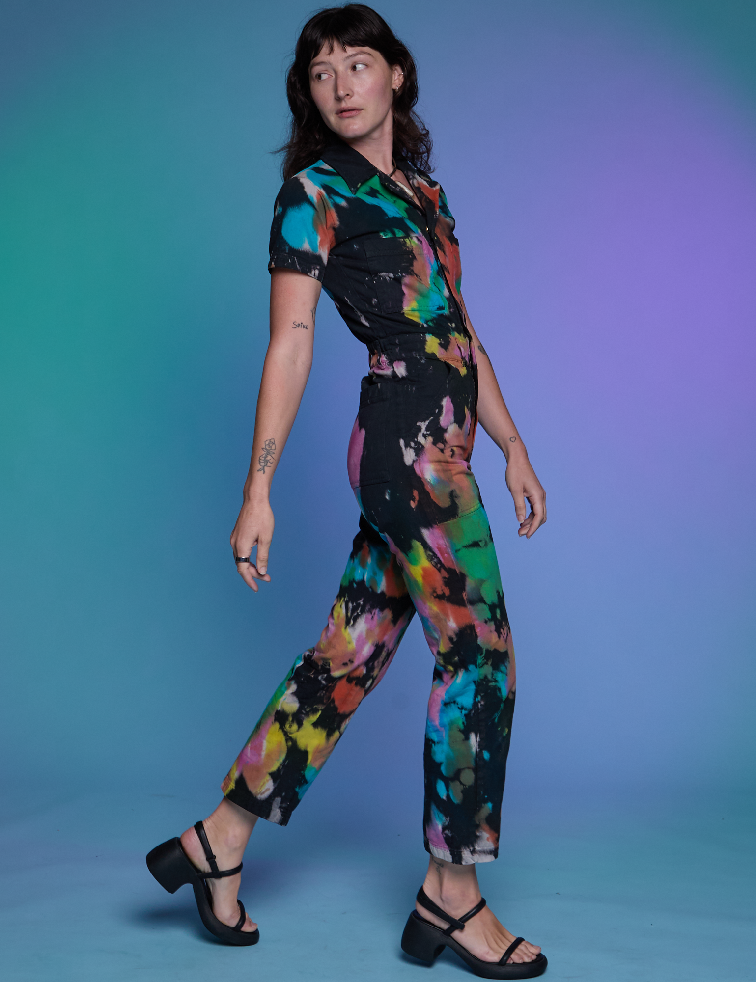 Short Sleeve Jumpsuit in Rainbow Magic Waters side view on Alex
