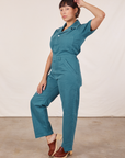 Angled view of Short Sleeve Jumpsuit in Marine Blue worn by Tiara