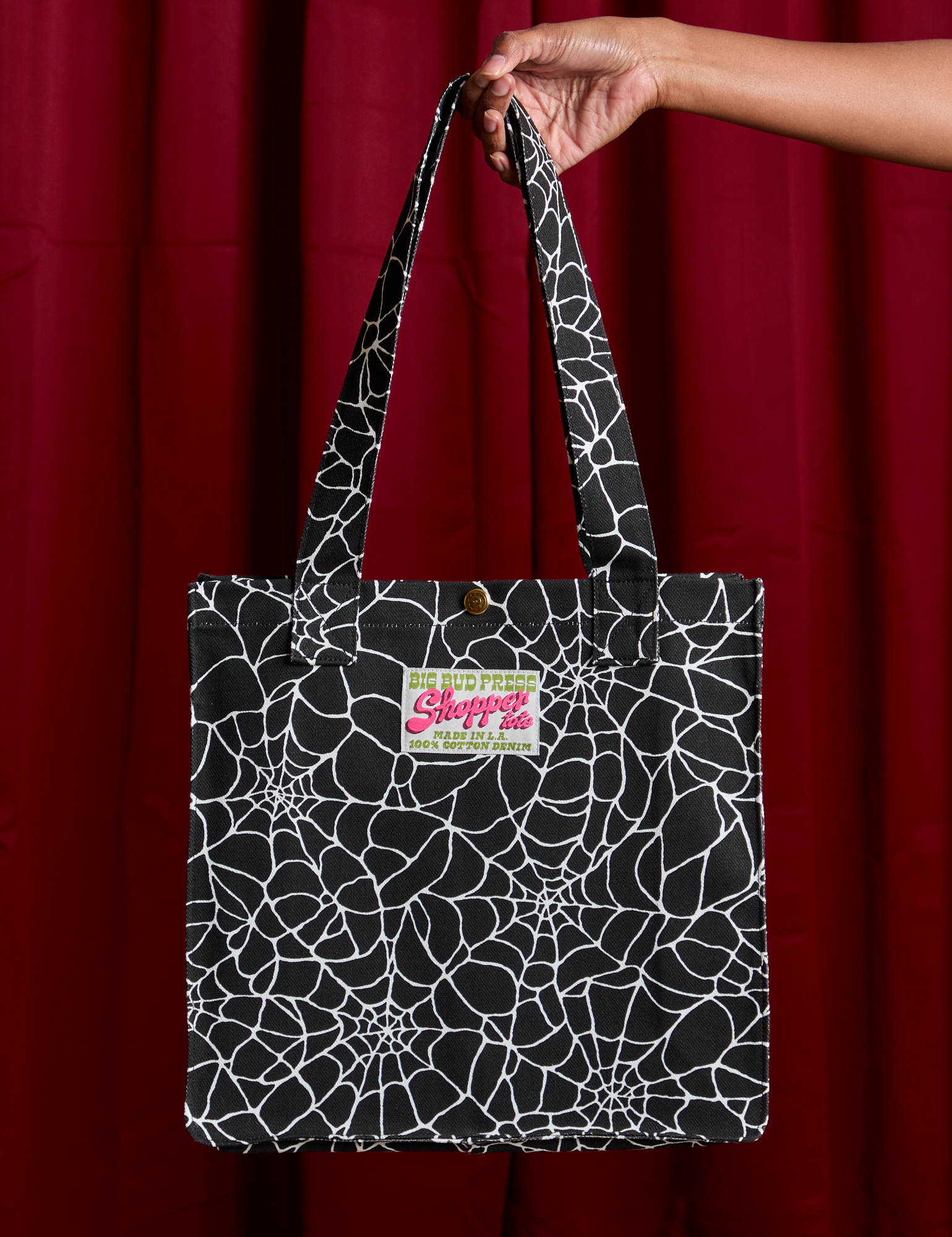 Spider Webs Printed Shopper Tote held by model