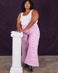 Morgan is wearing Star Bell Bottoms in Lilac Purple and Cropped Tank in vintage tee off-white