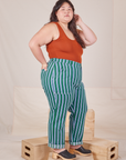 Side view of Stripe Work Pants in Green and burnt terracotta Tank Top