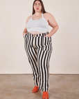 Marielena is 5'8" and wearing 2XL Black Striped Work Pants in White paired with vintage off-white Halter Top