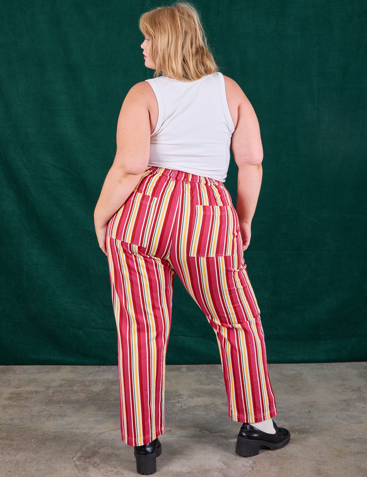 Back view of Stripe Work Pants in Cherry Candy and Cropped Tank in vintage tee off-white on Juliet