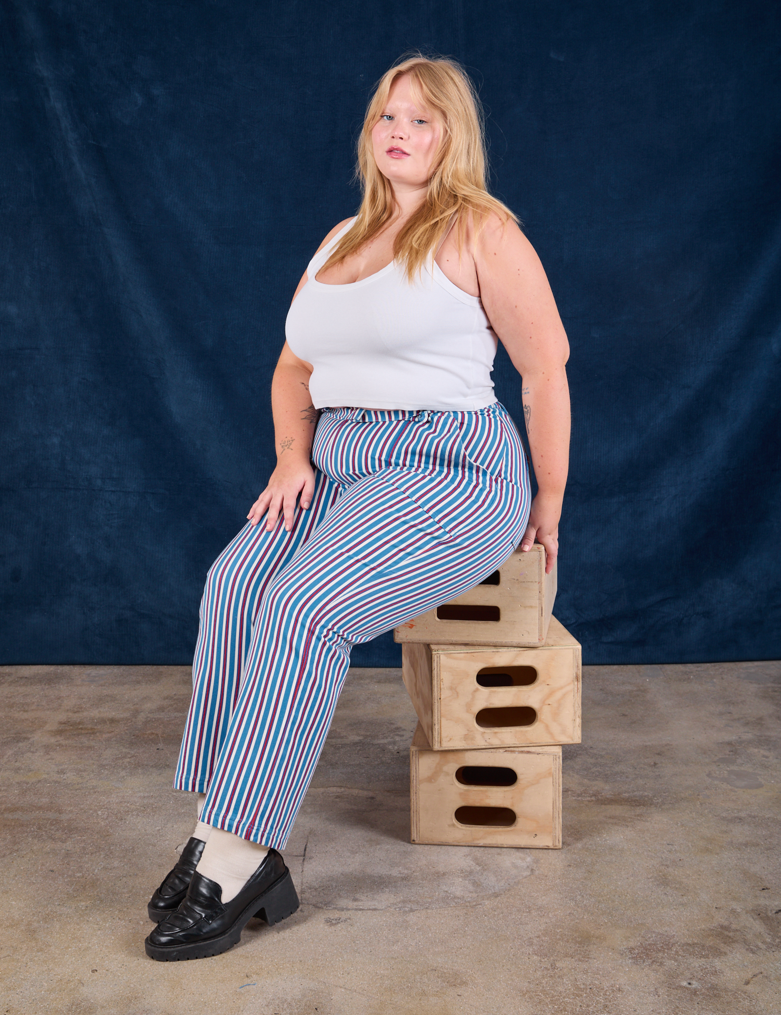 Juliet is wearing Stripe Work Pants in Blue Raspberry and Cropped Tank in vintage tee off-white