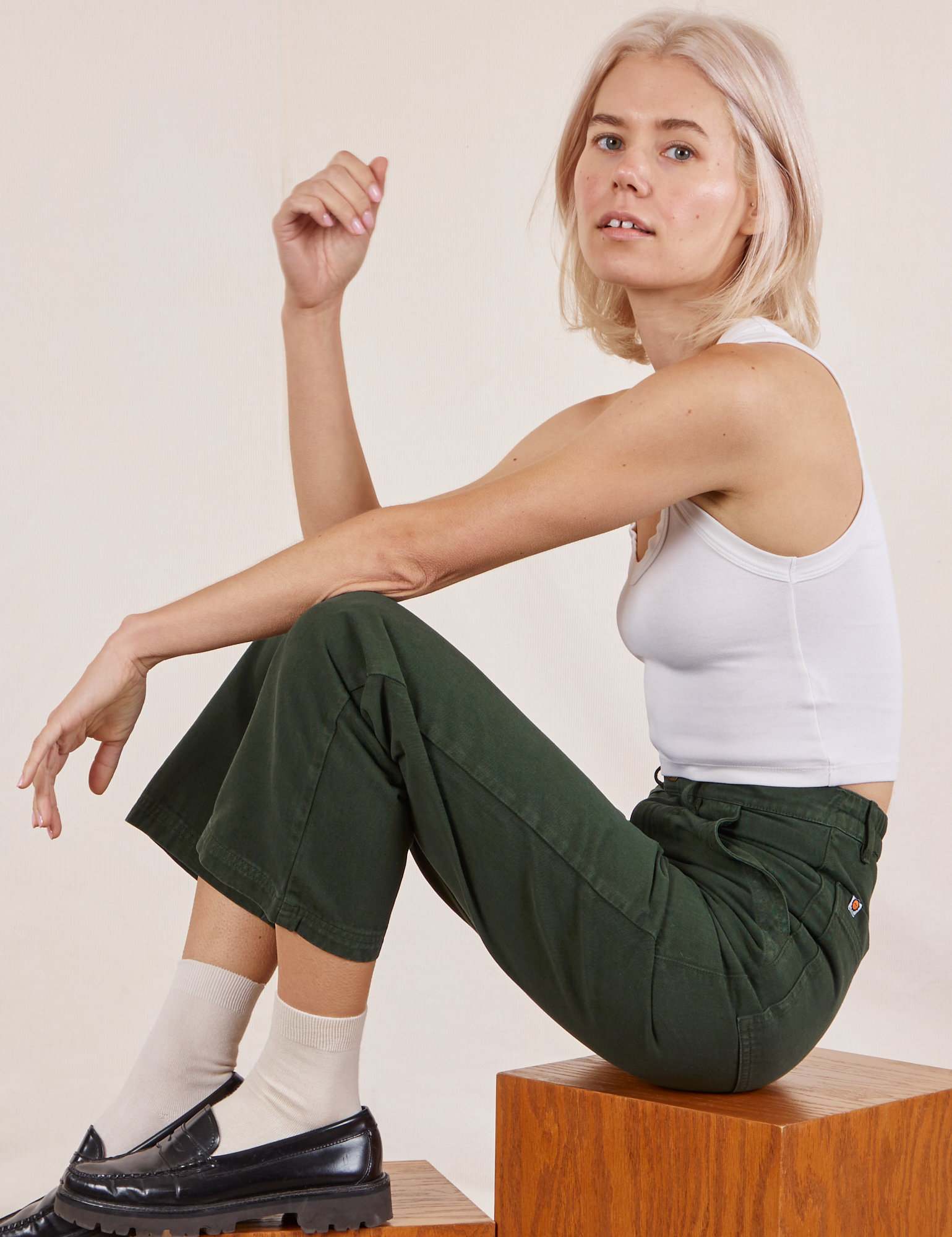Madeline is wearing Work Pants in Swamp Green and vintage tee off-white Cropped Tank