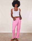 Jerrod is wearing Cropped Rolled Cuff Sweatpants in Bubblegum Pink and vintage off-white Cropped Tank Top