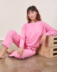 Alex is wearing Heavyweight Crew in Bubblegum Pink and matching Cropped Rolled Cuff Sweatpants