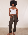 Jerrod is 6'3" and wearing M Cropped Rolled Cuff Sweatpants in Espresso Brown vintage off-white Cami