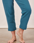 Cropped Rolled Cuff Sweatpants in Marine Blue pant leg close up on Alex