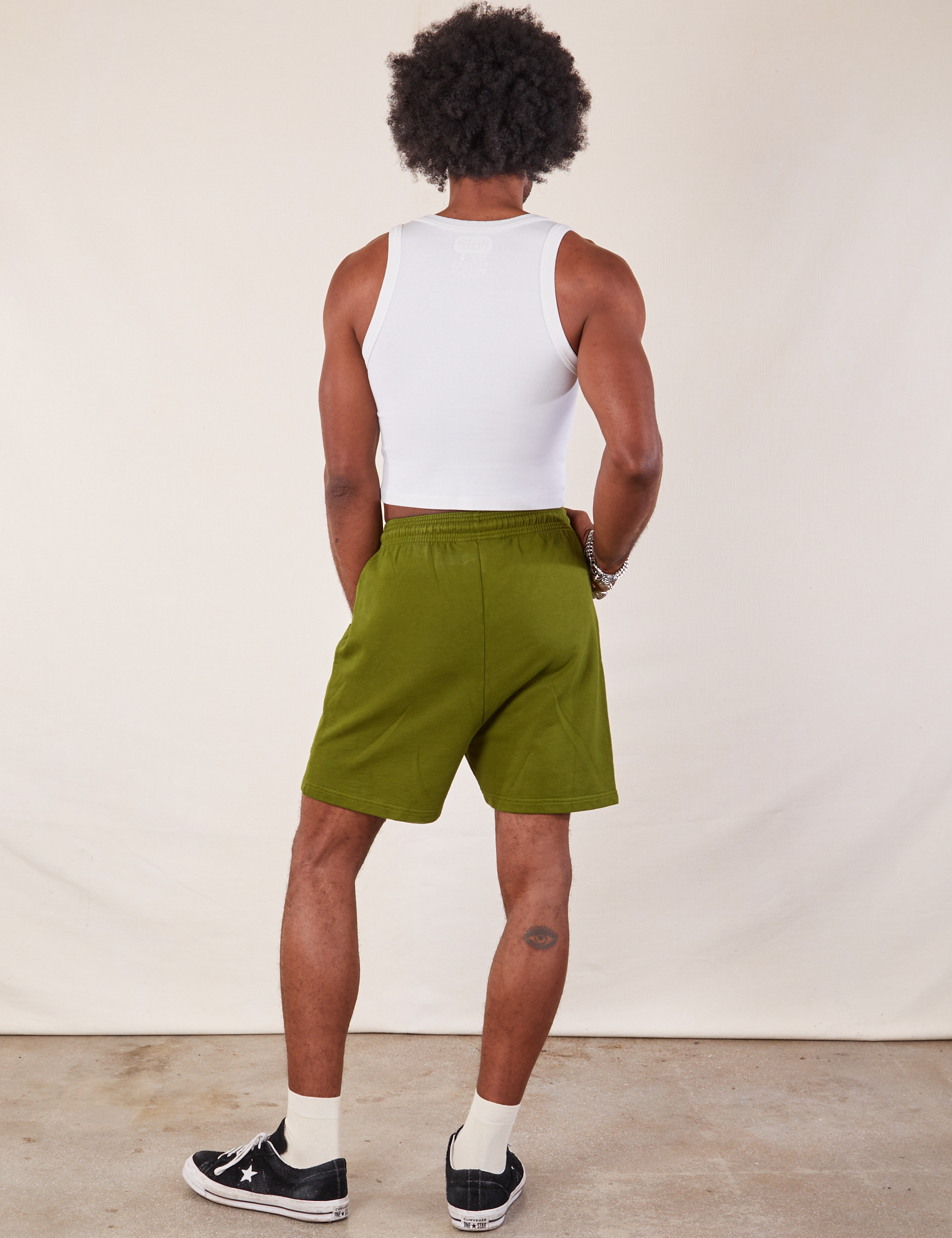 Back view of Lightweight Sweat Shorts in Summer Olive and Cropped Tank in vintage tee off-white on Jerrod