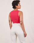 Back view of Tank Top in Hot Pink and vintage off-white Western Pants on Mika