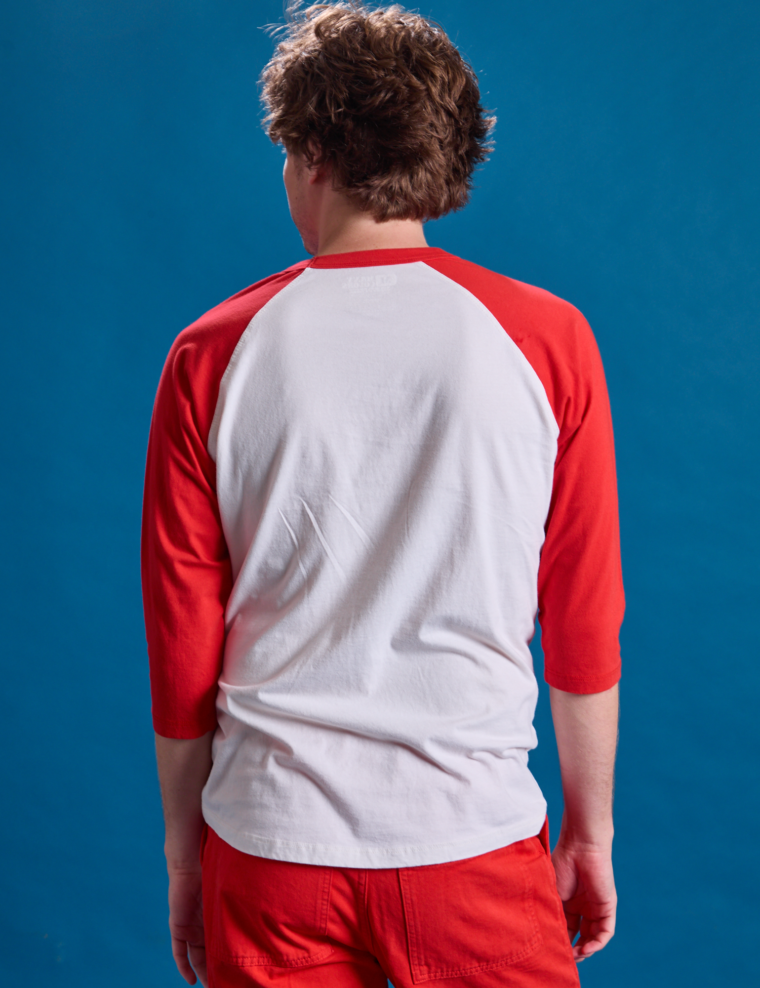 Taxi Raglan Tee in NYC back view on Quinn