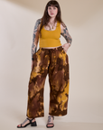 Sydney is 5'9" and wearing L for an oversized look Magic Waters Drop Pocket Pants in Honey Brown paired with mustard yellow Cropped Tank