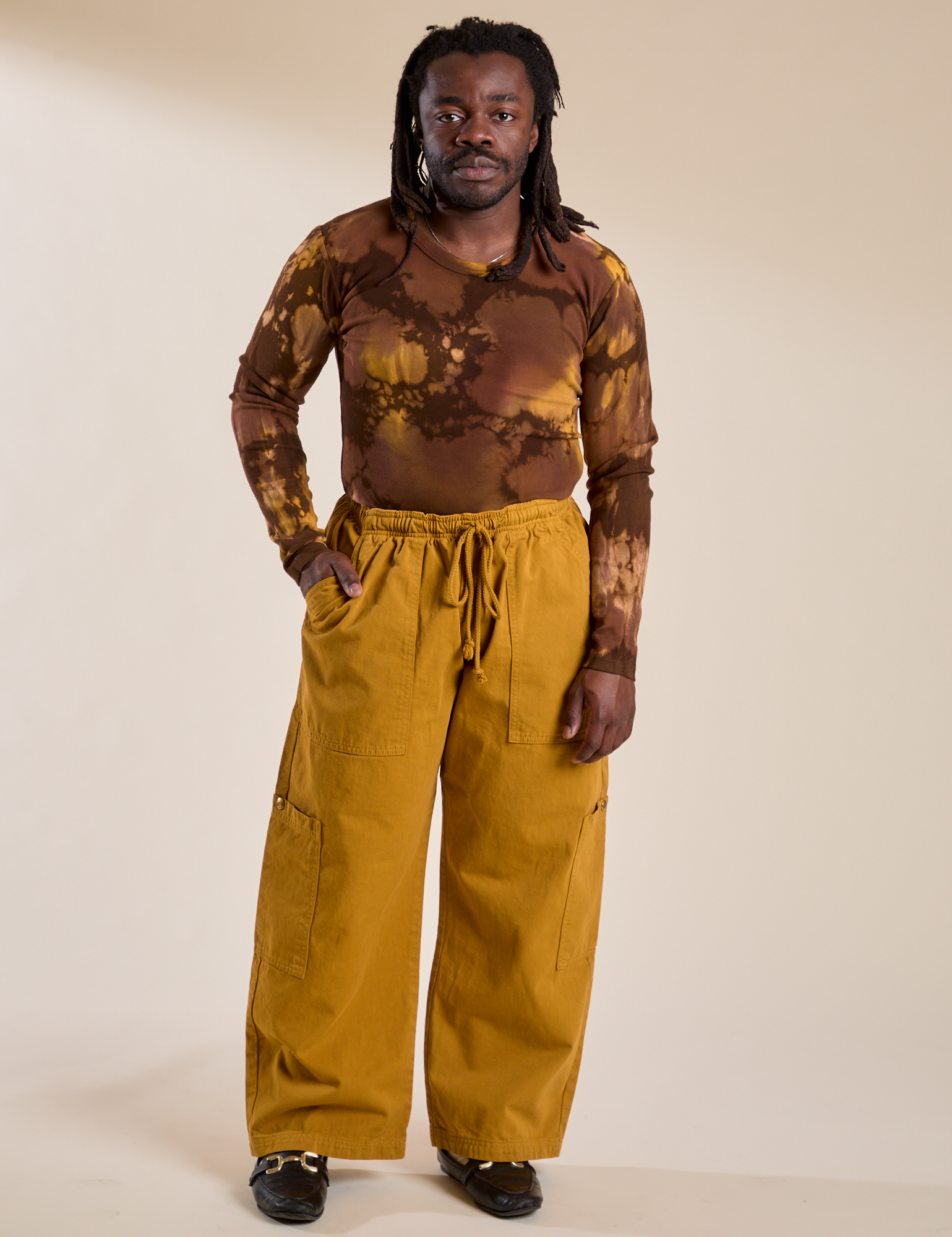 Demi is wearing Long Sleeve Baby Tee in Honey Brown and spicy mustard Drop Pocket Cargo Pants