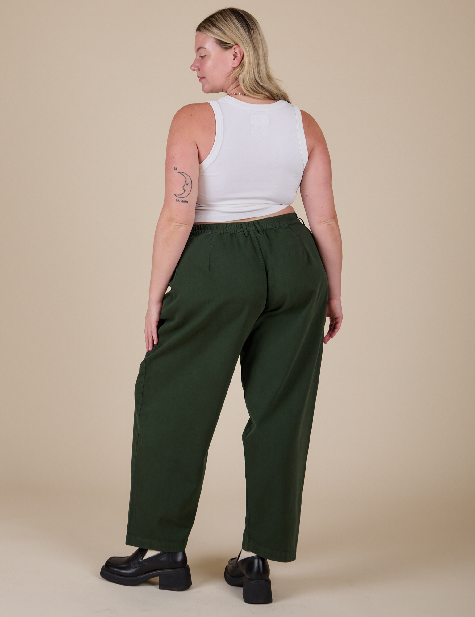 Back view of Heavyweight Trousers in Swamp Green and Cropped Tank in Vintage Tee White on Lish