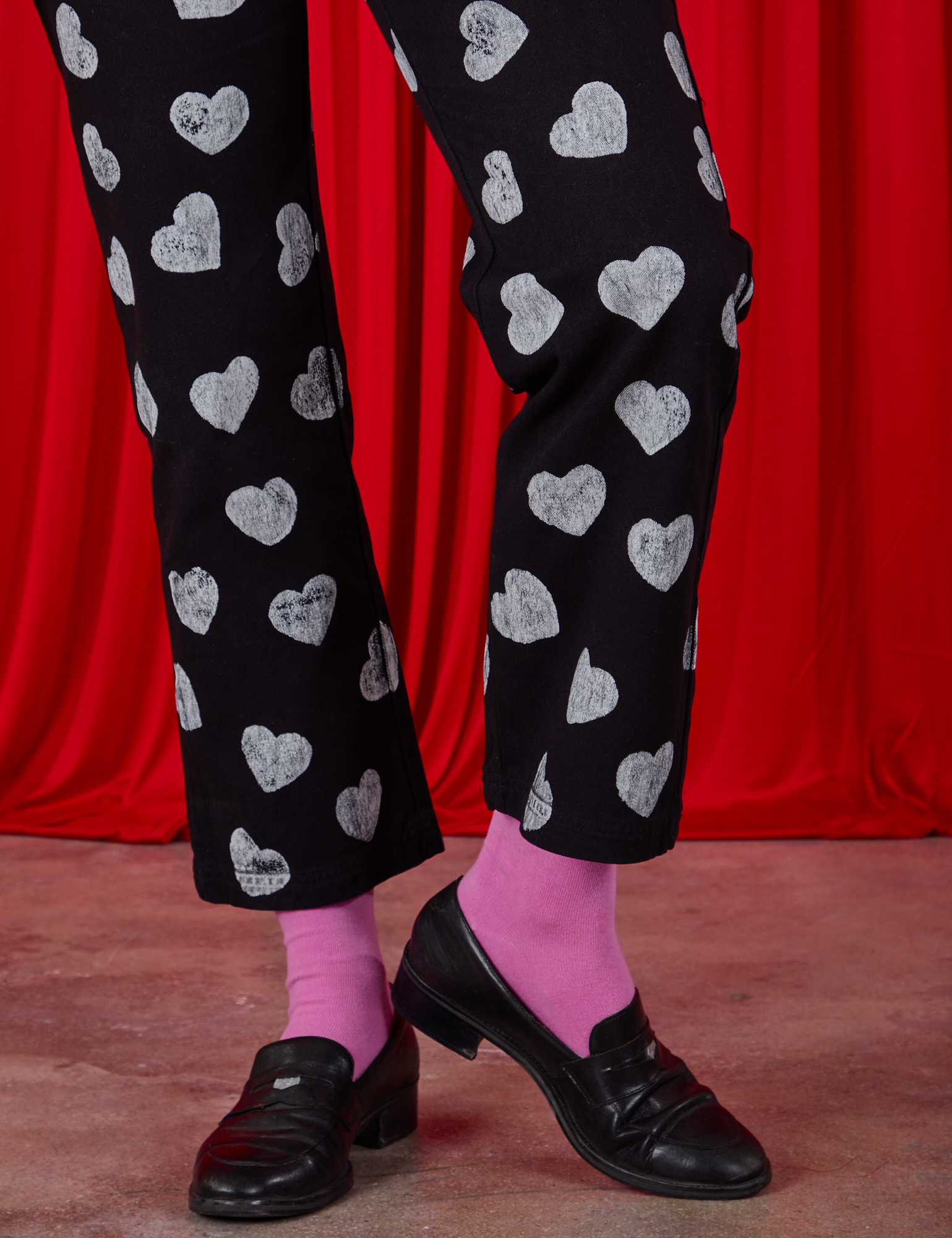 Paintstamped Heart Work Pants in Black pant leg close up on Alex