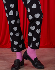 Paintstamped Heart Work Pants in Black pant leg close up on Alex