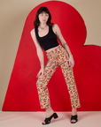 Alex is 5’8” and wearing XXS Work Pants in Hot Stuff Print paired with a black Cropped Tank