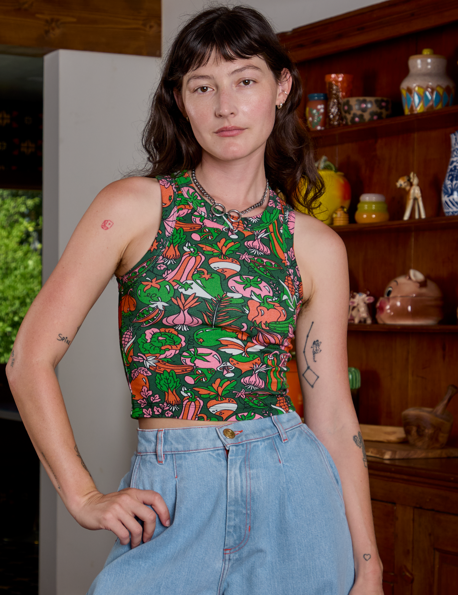 Alex is is 5&#39;8&quot; and wearing P Kitchen Collection Racerback Tank