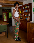 Side view of Work Pants in Kitchen Collection and Cropped Tank in Vintage Tee White on Jerrod
