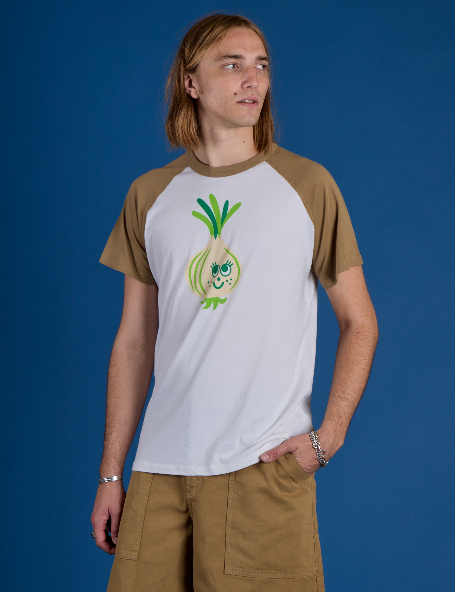 Grant is 6’5” and wearing L Produce Raglan Tee in Onion