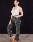 Angled front view of Wavy Dye Work Pants and vintage off-white Cropped Tank Top