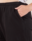 Wide Leg Sweat Pants in Basic Black side pocket close up with Ryan's hand