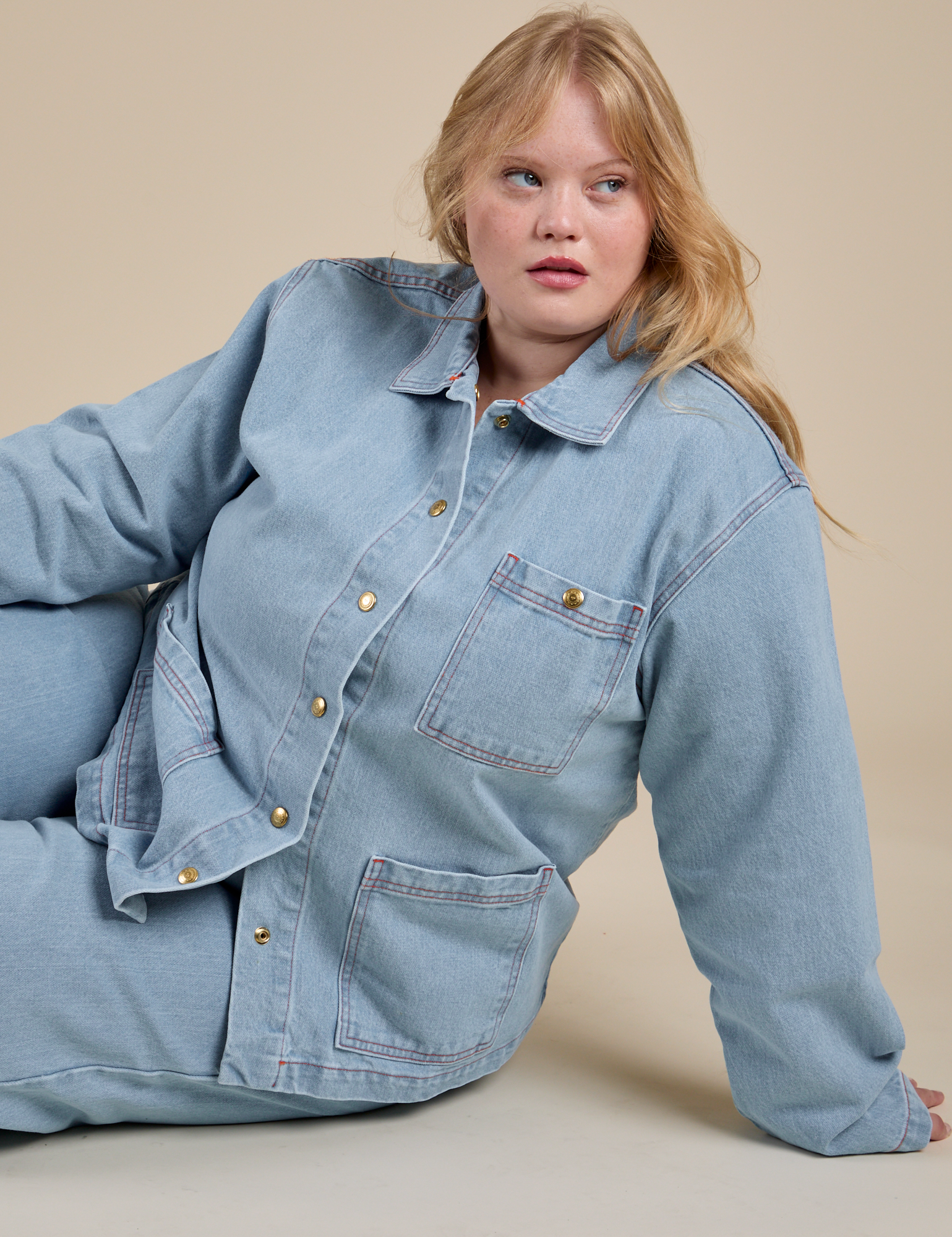 Juliet is wearing Indigo Denim Work Jacket in Light Wash