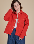 Hana is 5'3" and wearing P Denim Work Jacket in Mustang Red