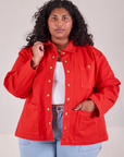 Morgan is 5'5" and wearing 1XL Denim Work Jacket in Mustang Red